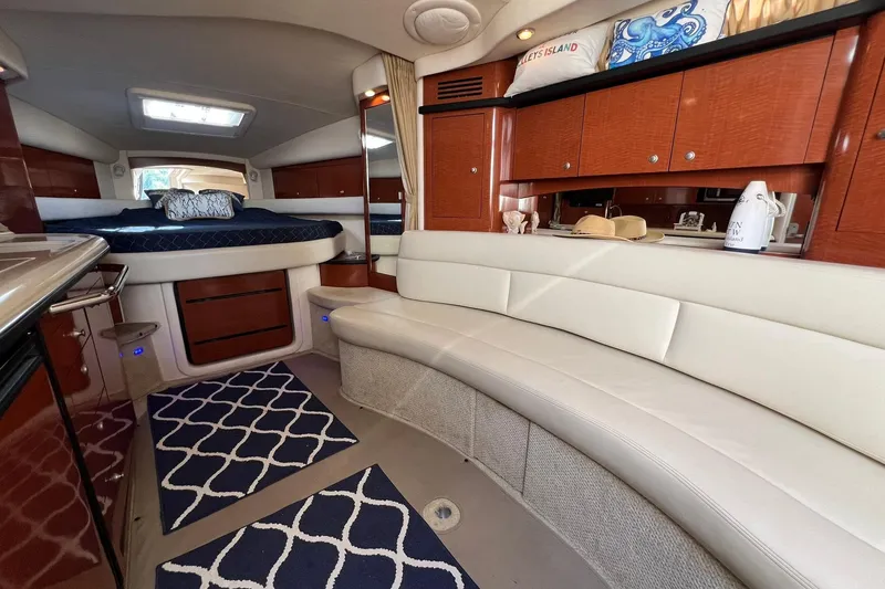 Slide: The Image of Luxurious interior of 2005 Sea Ray 340 Sundancer yacht with elegant seating and bedding. - 20