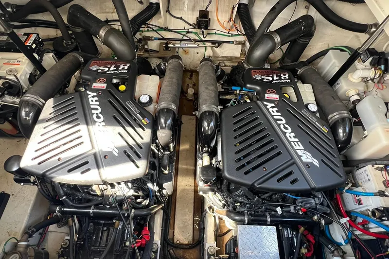 Slide: The Image of Engine room of a 2005 Sea Ray 340 Sundancer with twin Mercury engines. - 23