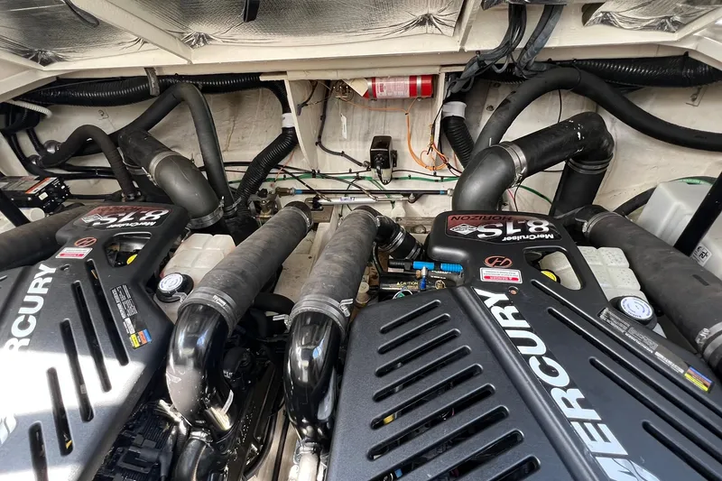 Slide: The Image of Engine compartment of a 2005 Sea Ray 340 Sundancer with Mercury 8.1S engines. - 24
