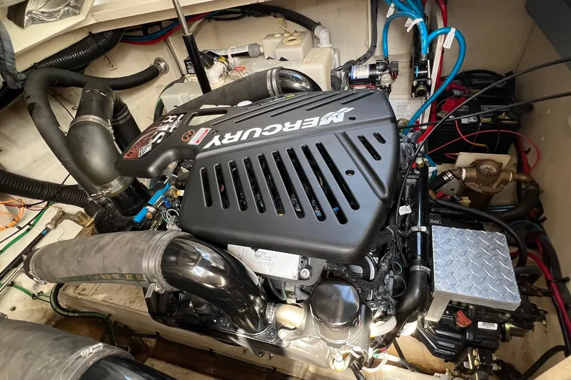 Slide: The Image of Engine compartment of a 2005 Sea Ray 340 Sundancer with a Mercury engine. - 25