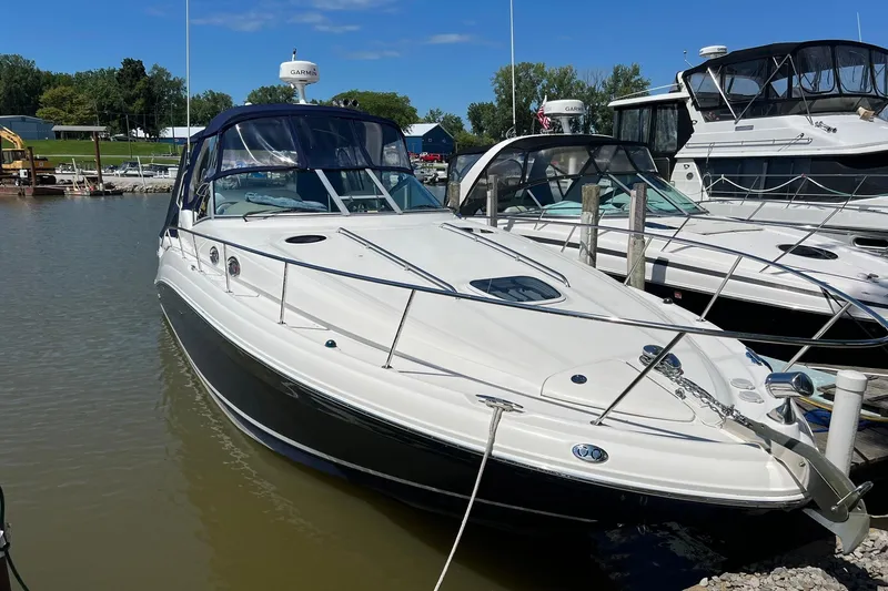 Slide: The Image of 2005 Sea Ray 340 Sundancer docked at marina under clear blue sky. - 28