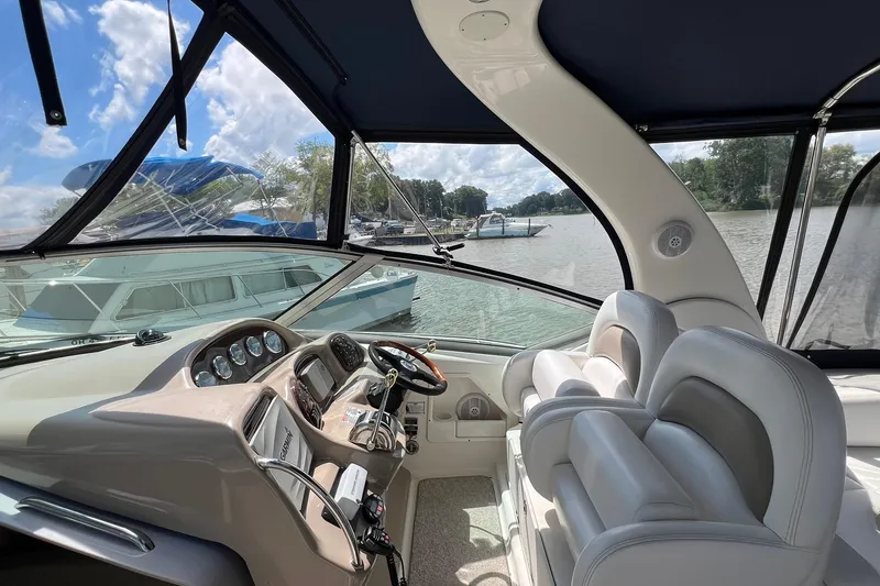 Slide: The Image of Interior view of 2005 Sea Ray 340 Sundancer boat with helm and seating. - 6