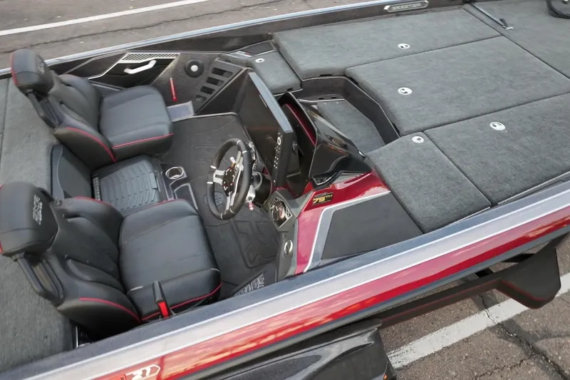 Slide: The Image of 2023 Skeeter FXR21 boat interior with sleek seating and modern dashboard design. - 12