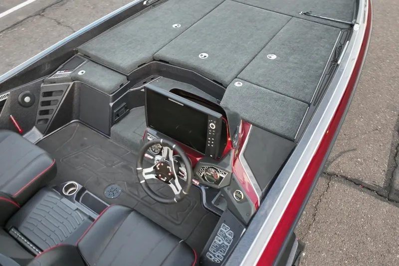Slide: The Image of 2023 Skeeter FXR21 boat interior with modern dashboard and seating. - 13