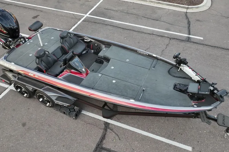 Slide: The Image of 2023 Skeeter FXR21 bass boat in parking lot, top view. - 4