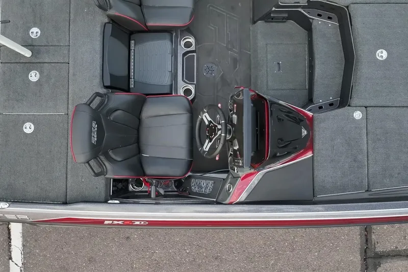 Slide: The Image of 2023 Skeeter FXR21 boat interior with black seats and modern dashboard design. - 7