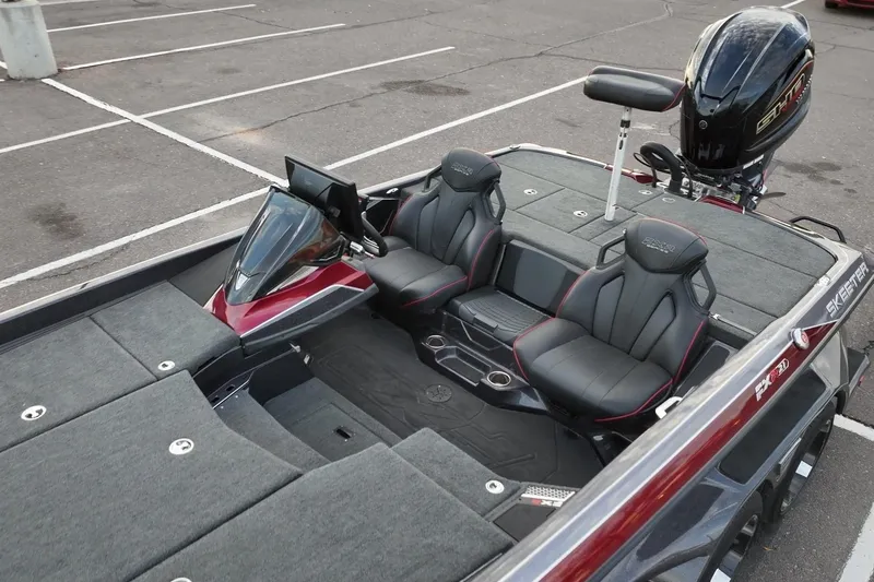 Slide: The Image of 2023 Skeeter FXR21 boat interior with dual seats and modern dashboard. - 9