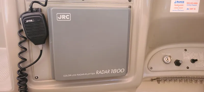 Slide: The Image of JRC Radar 1800 on 1998 Maxum 3000 SCR boat dashboard with microphone. - 11
