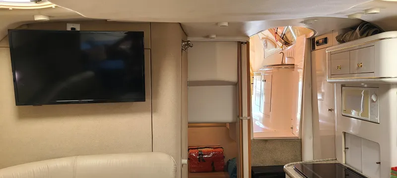 Slide: The Image of Interior of 1998 Maxum 3000 SCR boat with TV and kitchenette. - 15