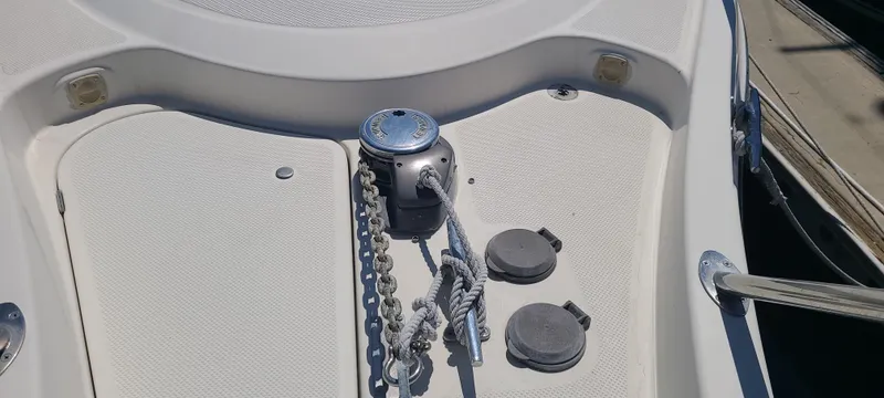 Slide: The Image of Bow deck of 1998 Maxum 3000 SCR with anchor chain and winch. - 22