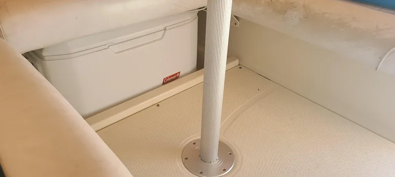 Slide: The Image of Interior of 1998 Maxum 3000 SCR boat with storage compartment and cooler. - 4