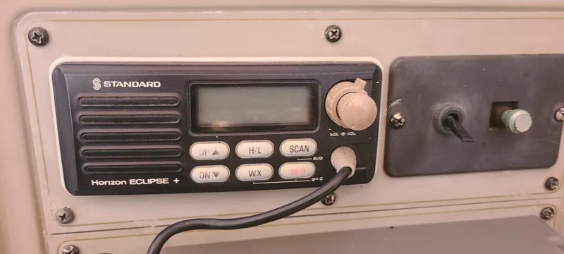 Slide: The Image of 1998 Maxum 3000 SCR boat radio panel with Standard Horizon Eclipse+ VHF radio. - 9
