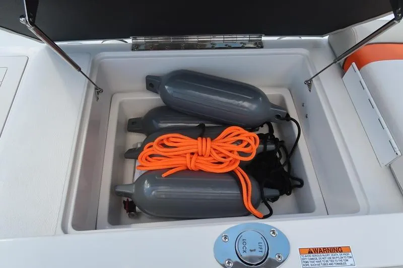 Slide: The Image of Storage compartment with boat fenders and orange rope on a 2020 Starcraft MDX OB 211 E OB. - 13