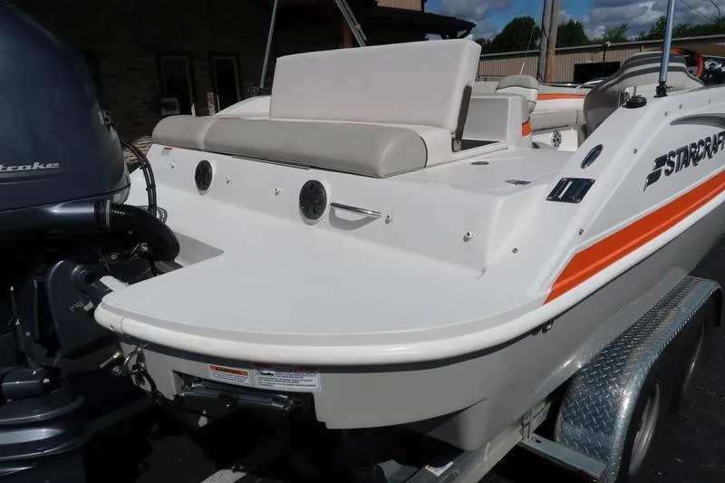 Slide: The Image of 2020 Starcraft MDX OB 211 E OB boat, rear view with motor and seating. - 9