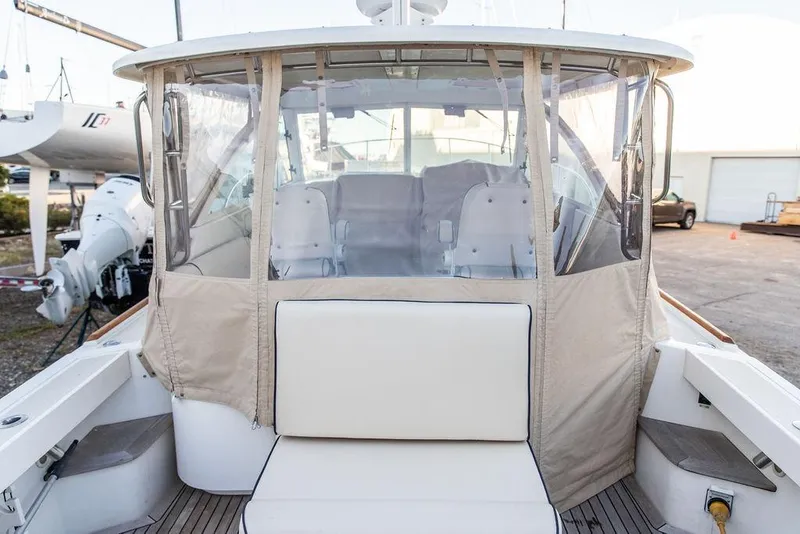 Slide: The Image of 2008 Hunt Yachts Surfhunter 29 with covered cockpit and seating area. - 6