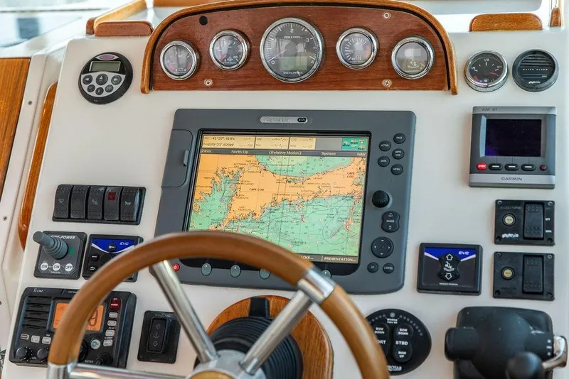Slide: The Image of 2008 Hunt Yachts Surfhunter 29 dashboard with navigation and control instruments. - 8