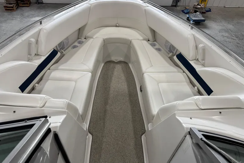 Slide: The Image of 1999 Formula 280 Bowrider interior with white seating and carpeted floor. - 11