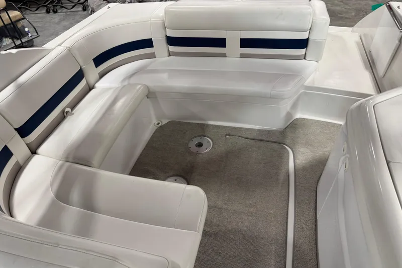 Slide: The Image of 1999 Formula 280 Bowrider interior with white seating and carpeted floor. - 9