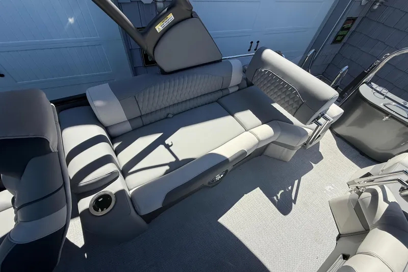 Slide: The Image of Luxurious seating on 2026 Avalon 2585 Catalina Windshield Quad Lounger, Tri toon boat interior. - 12