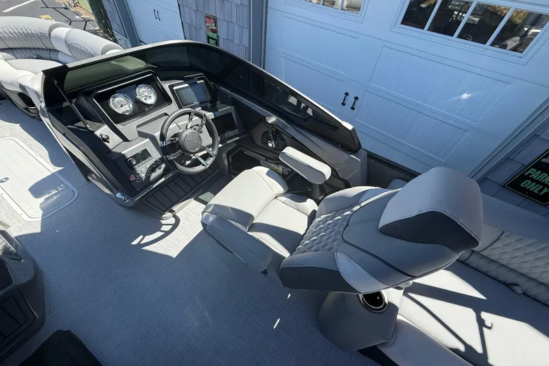 Slide: The Image of 2026 Avalon 2585 Catalina boat interior with modern dashboard and luxurious seating. - 13