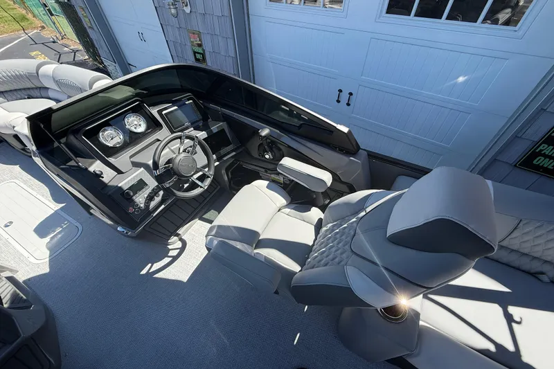 Slide: The Image of Luxurious interior of 2026 Avalon 2585 Catalina Windshield Quad Lounger with advanced controls. - 22