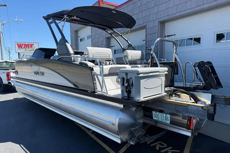 Slide: The Image of 2026 Avalon 2585 Catalina pontoon boat with Mercury 350hp V-10 engine, parked outdoors. - 5