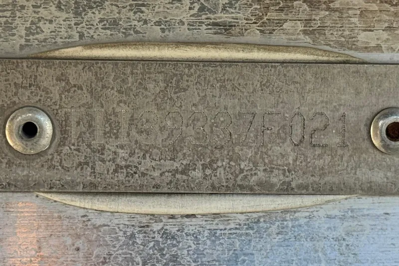 Slide: The Image of 2021 Manitou 23 Aurora LE Standard metal identification plate with engraved serial number. - 27