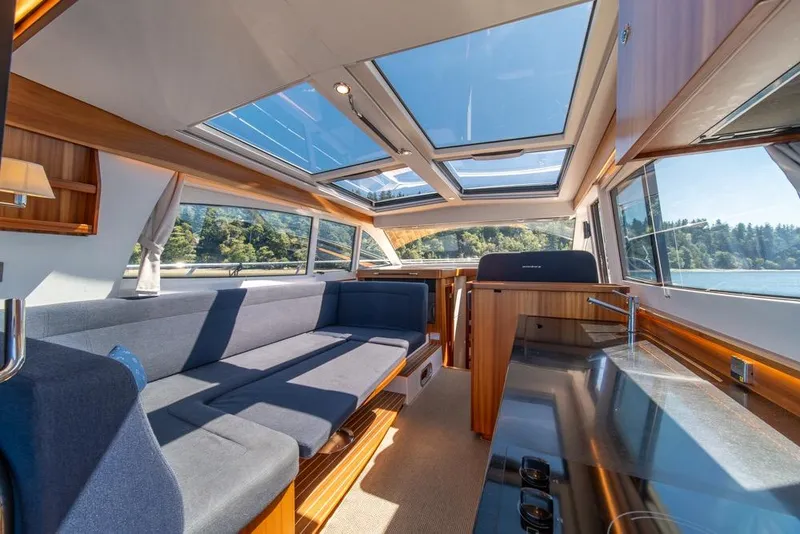 Slide: The Image of Luxurious interior of 2022 Nimbus 405 Coupé yacht with panoramic windows and modern design. - 14