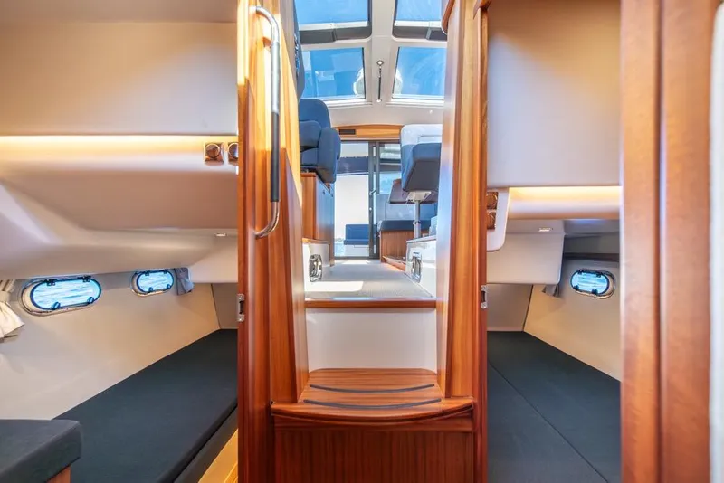 Slide: The Image of Interior of 2022 Nimbus 405 Coupé yacht, featuring cozy cabins and modern design. - 23