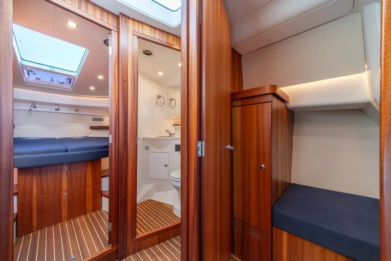 Slide: The Image of Luxurious interior of 2022 Nimbus 405 Coupé yacht with wood finish and modern amenities. - 24