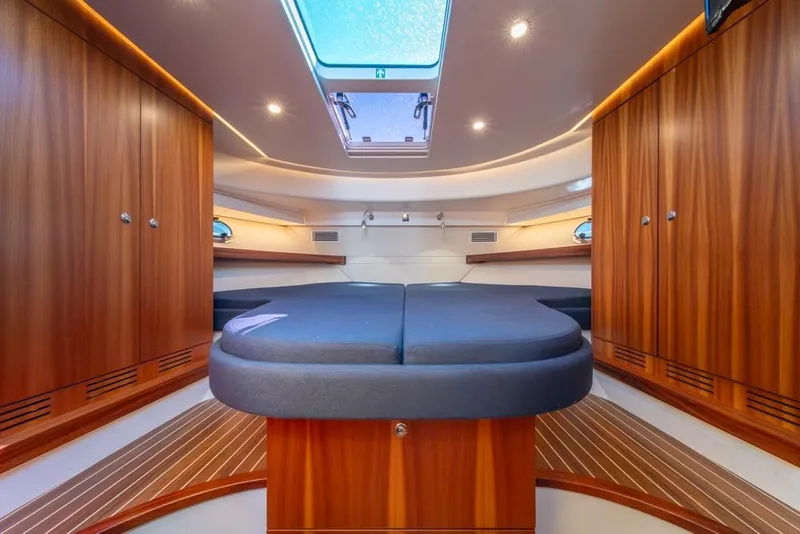 Slide: The Image of Luxurious interior of 2022 Nimbus 405 Coupé yacht with wood finish and skylight. - 26