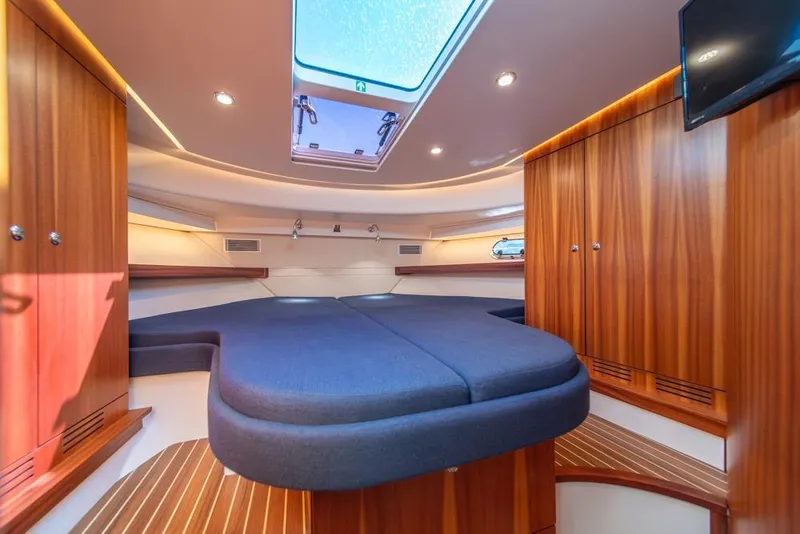 Slide: The Image of Luxurious interior of 2022 Nimbus 405 Coupé with wood finish and skylight. - 27