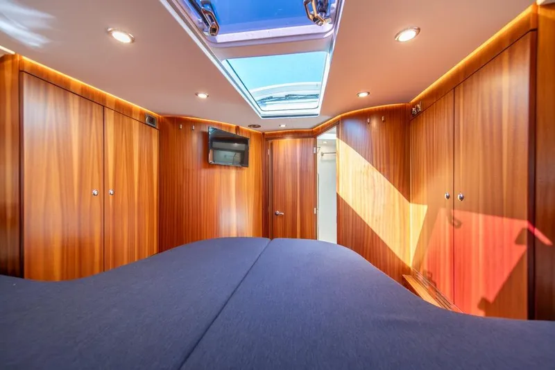 Slide: The Image of Luxurious interior of 2022 Nimbus 405 Coupé with wood paneling and skylight. - 28