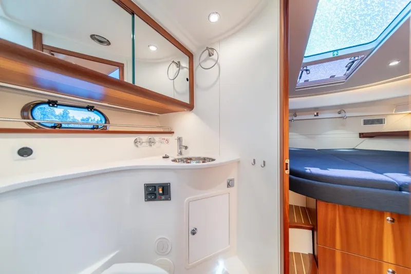 Slide: The Image of Luxurious interior of 2022 Nimbus 405 Coupé yacht with modern bathroom and cozy bedroom. - 29