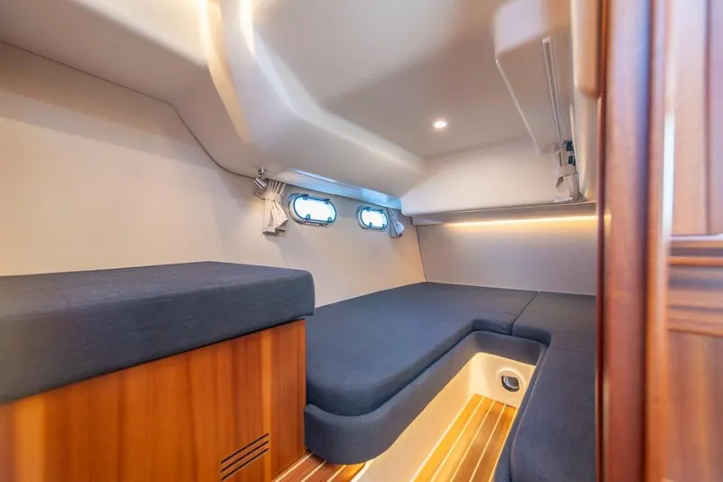 Slide: The Image of Interior cabin of 2022 Nimbus 405 Coupé, featuring cozy seating and modern design. - 32