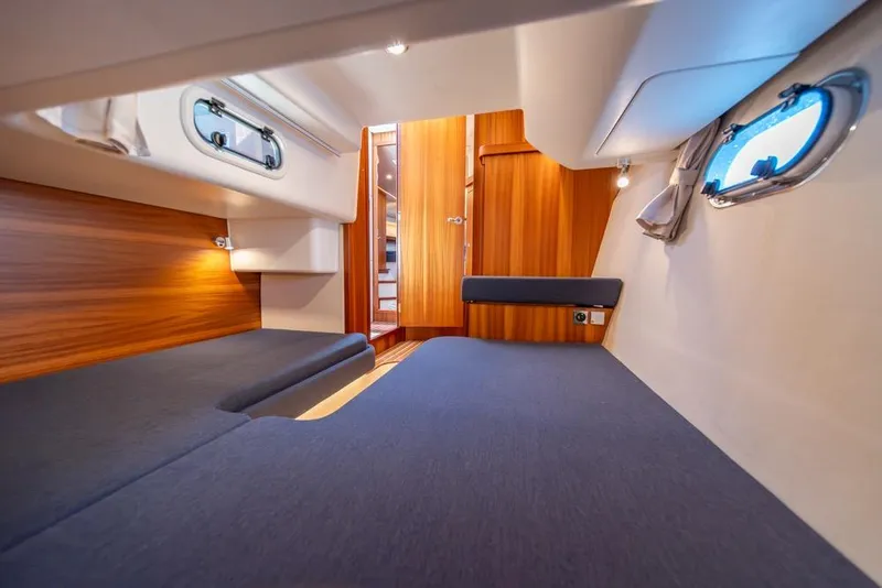 Slide: The Image of Interior of 2022 Nimbus 405 Coupé cabin with wooden accents and cozy seating. - 34