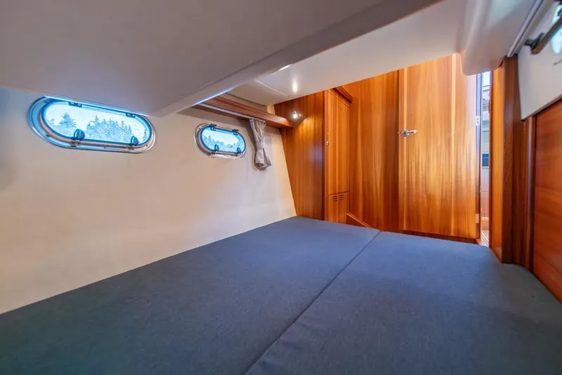 Slide: The Image of Interior cabin of 2022 Nimbus 405 Coupé with wooden finish and porthole windows. - 36