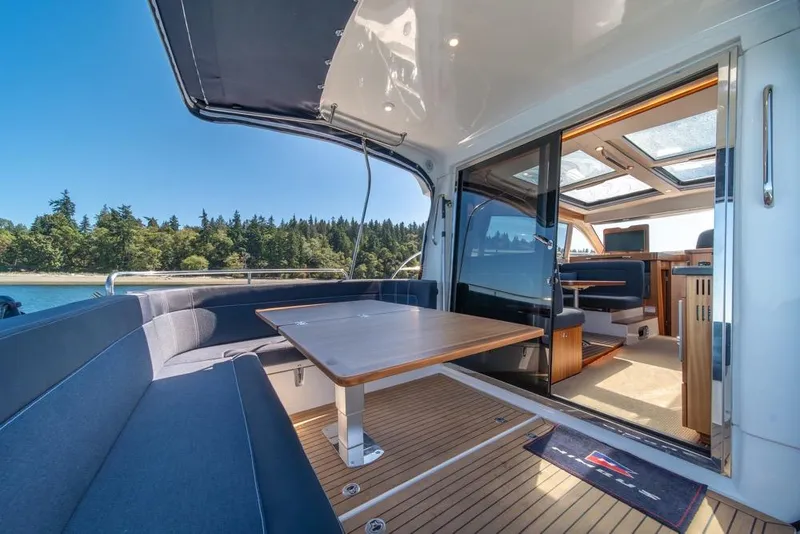 Slide: The Image of Luxurious 2022 Nimbus 405 Coupé yacht interior with spacious seating and elegant design. - 41