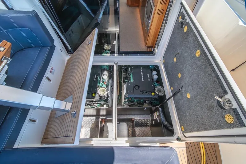 Slide: The Image of Engine compartment of 2022 Nimbus 405 Coupé yacht, showcasing dual Volvo Penta engines. - 44