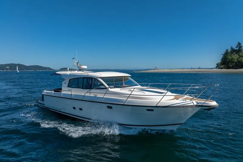 Slide: The Image of 2022 Nimbus 405 Coupé yacht cruising on a sunny day in open waters. - 48