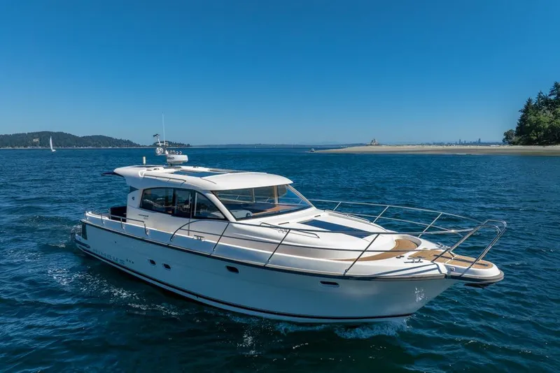 Slide: The Image of 2022 Nimbus 405 Coupé yacht cruising on a sunny day in open waters. - 49