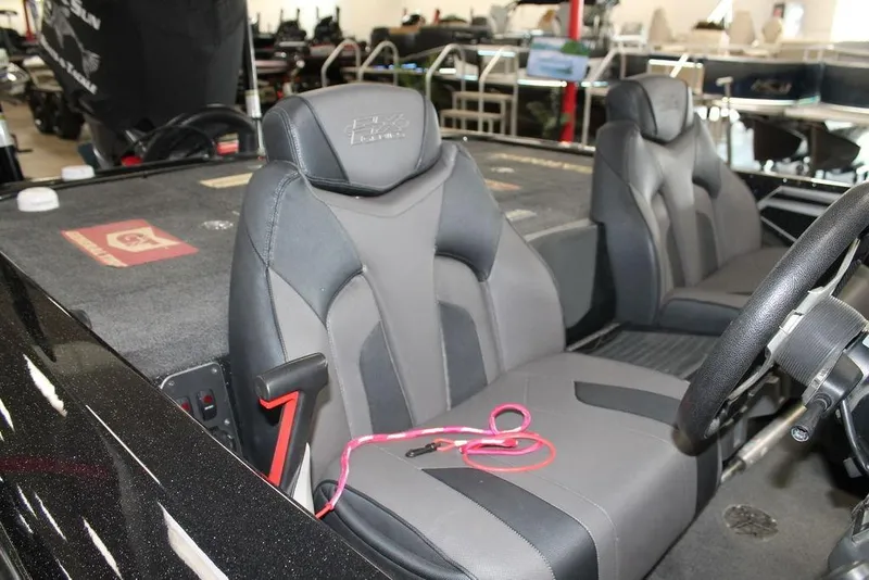 Slide: The Image of 2019 Skeeter FX21 LE boat interior with gray seats and steering wheel. - 4