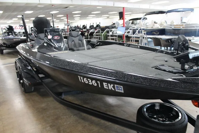 Slide: The Image of 2019 Skeeter FX21 LE bass boat displayed in showroom, featuring sleek design and modern equipment. - 8