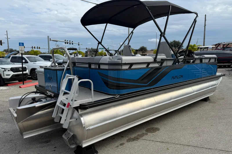 Slide: The Image of 2026 Avalon 2385 Venture 85 Quad Lounger Tri Toon boat with blue exterior and canopy. - 33