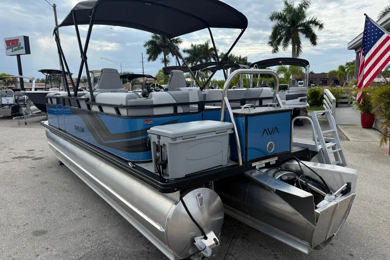 Slide: The Image of 2026 Avalon 2385 Venture 85 Quad Lounger Tri Toon boat with canopy and American flag. - 36