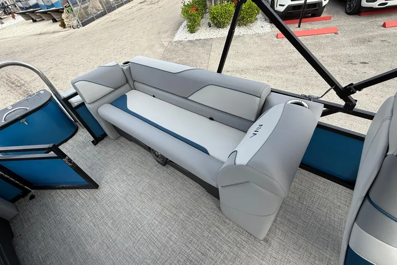 Slide: The Image of 2026 Avalon 2385 Venture 85 Quad Lounger interior with gray and blue seating. - 48