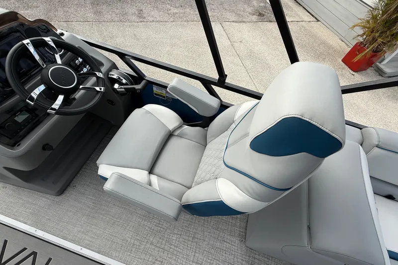 Slide: The Image of 2026 Avalon 2385 Venture boat interior with steering wheel and plush seating. - 51