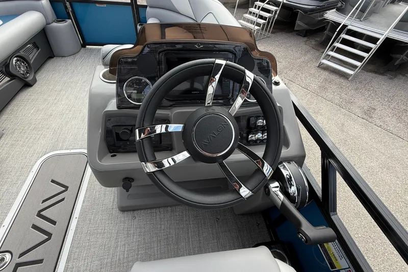 Slide: The Image of Steering console of 2026 Avalon 2385 Venture 85 Quad Lounger, Tri Toon High Performance boat. - 53