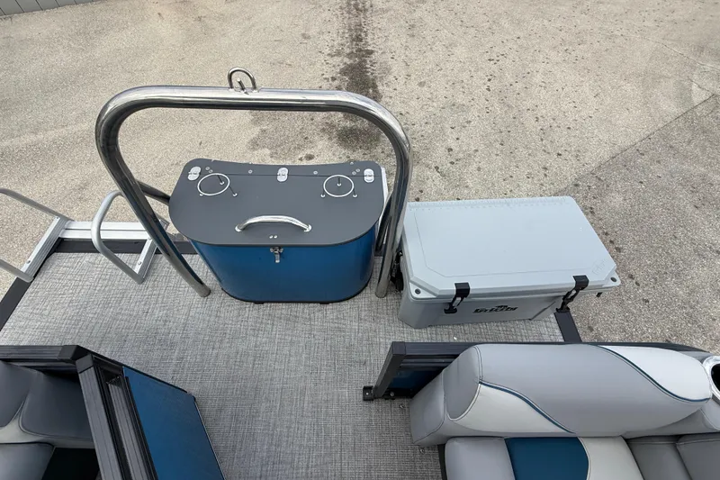 Slide: The Image of 2026 Avalon 2385 Venture 85 Quad Lounger boat deck with cooler and seating. - 56