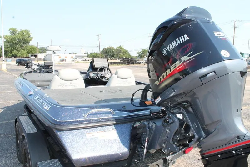 Slide: The Image of 2021 Skeeter ZX225 boat with Yamaha VMAX engine in a parking lot. - 4